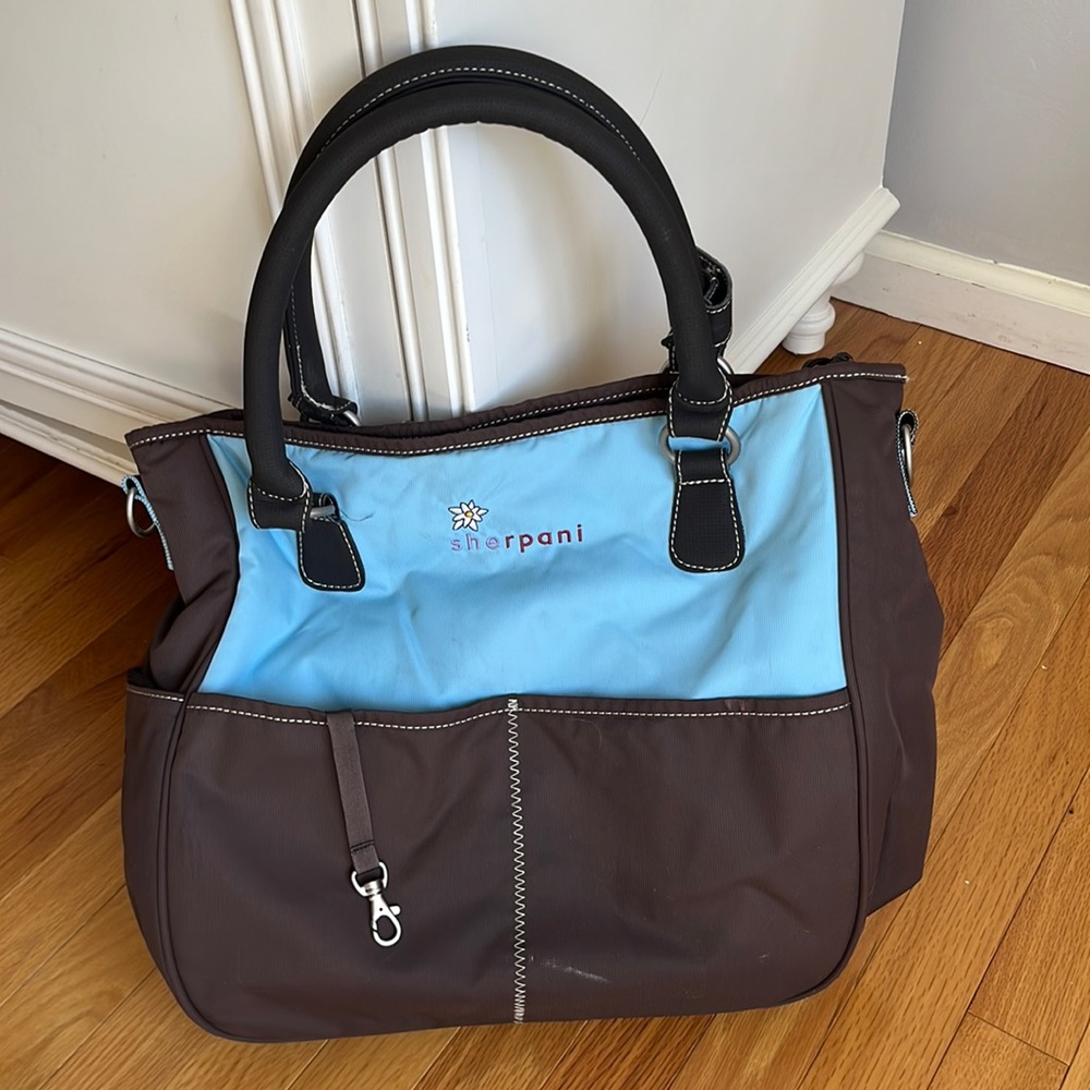 Lightly used Sherpani tote in blue and brown.